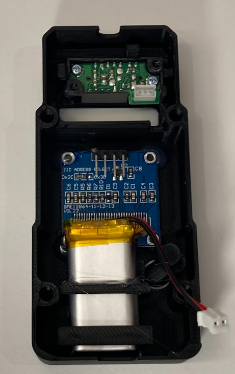 Battery installed writing-side down in the trainer case