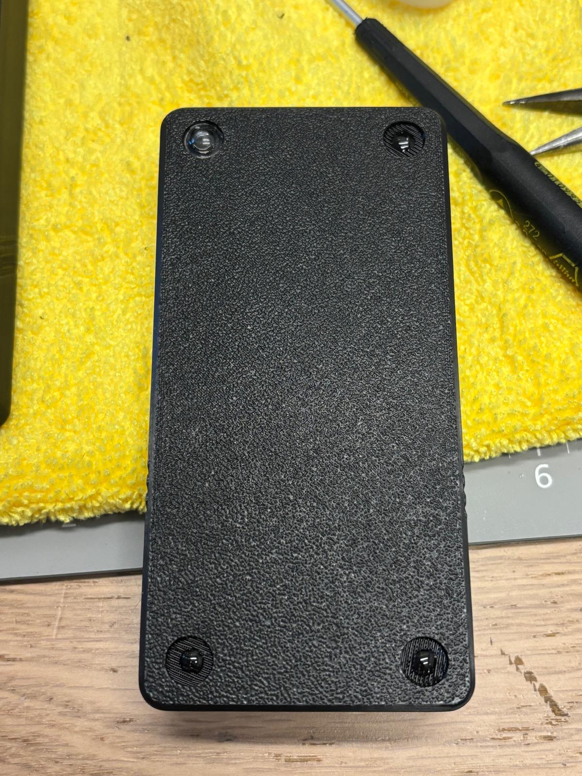 Rubber feet installed on backplate