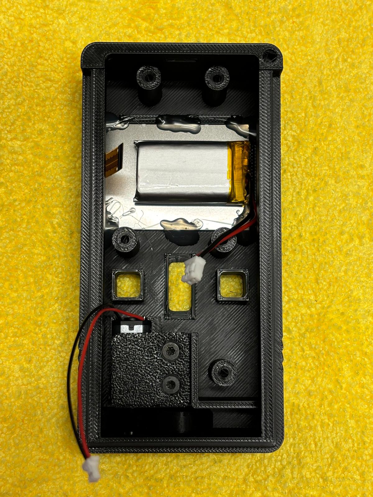 Screen and battery installed in top housing