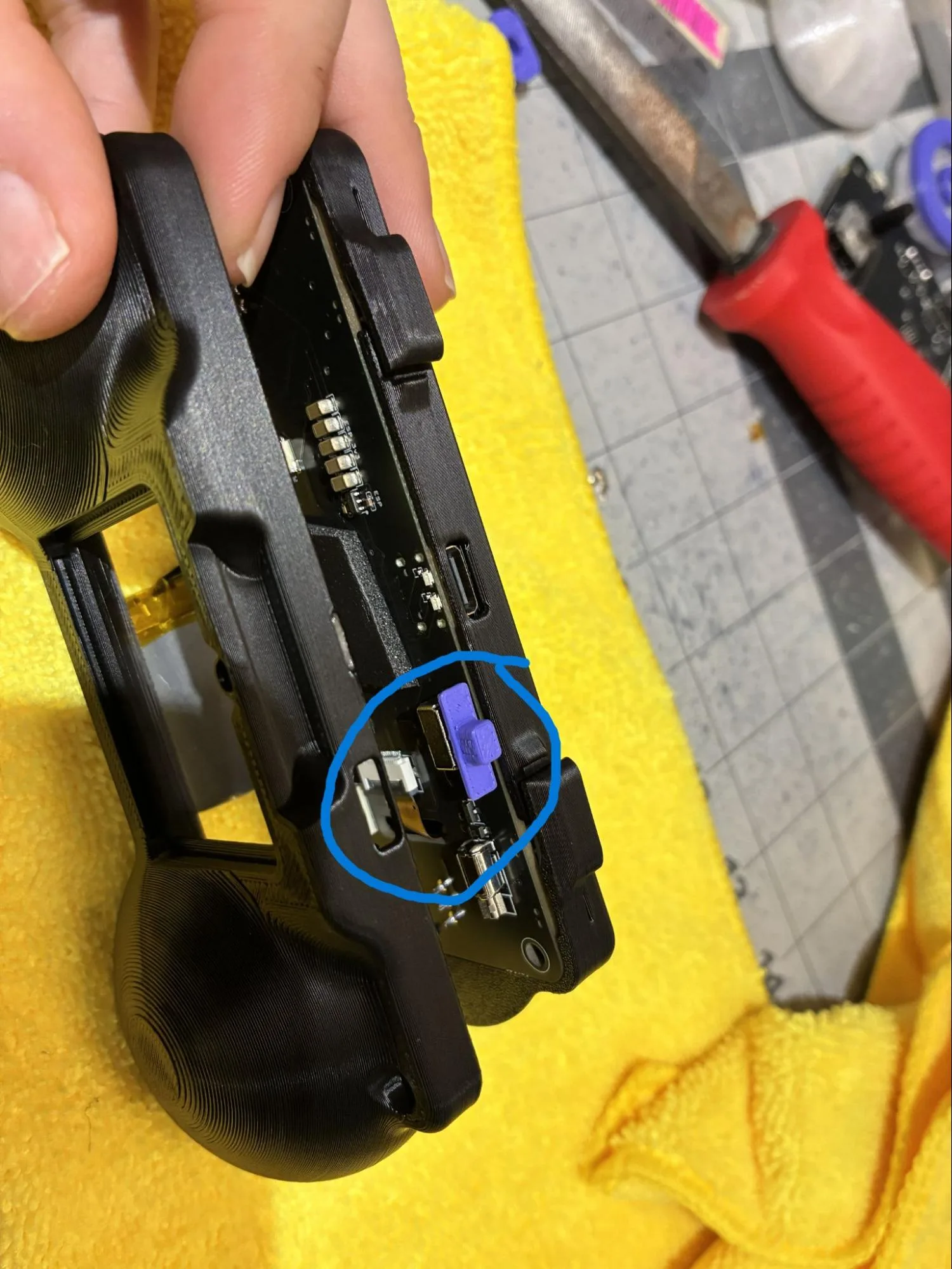RADR back housing aligned over the front housing with the power switch entering its cutout
