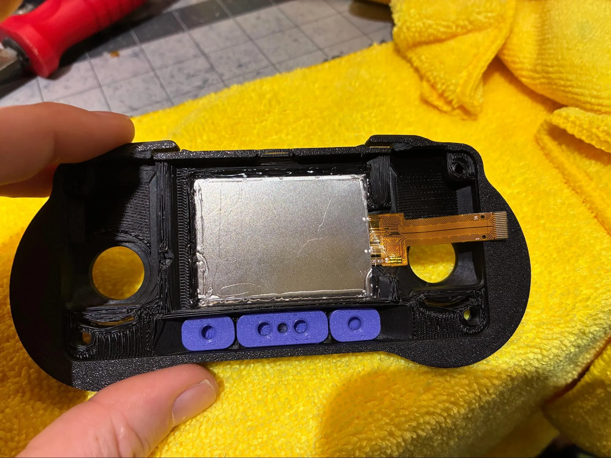 Printed RADR buttons installed in the front housing