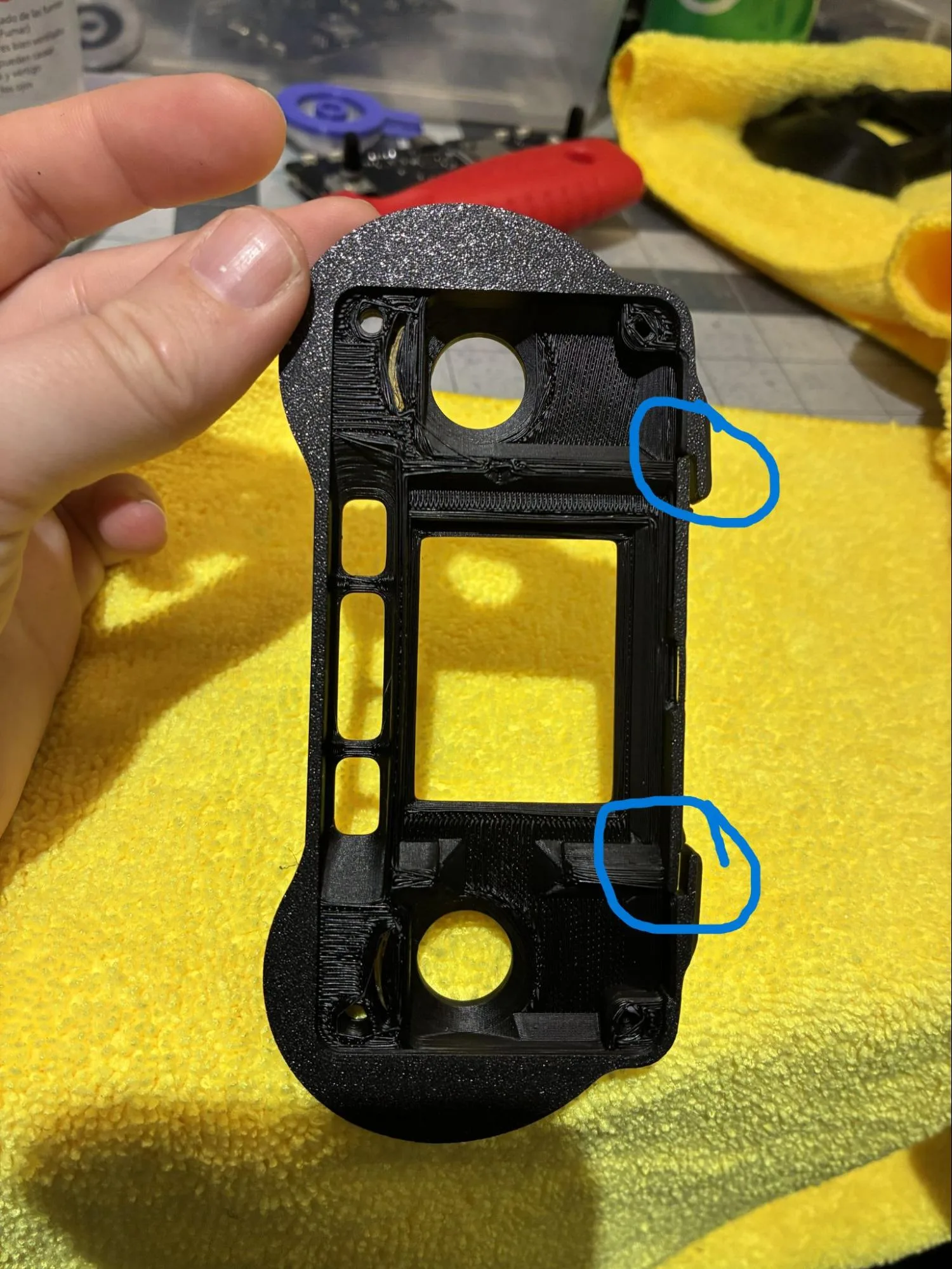 Front housing bumper features marked for trimming