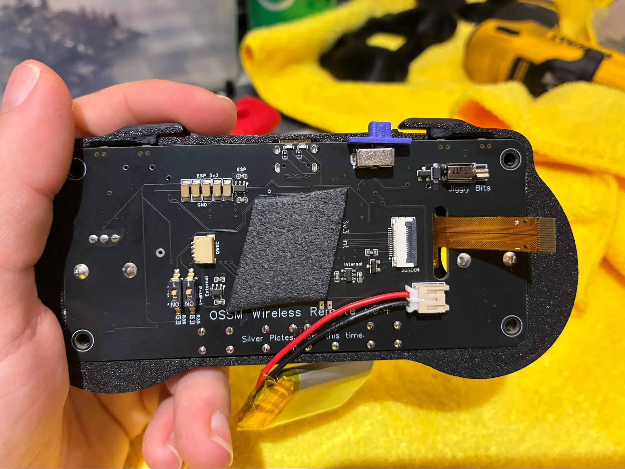 RADR PCB assembly seated in the front housing with screen ribbon routed through the PCB cutout