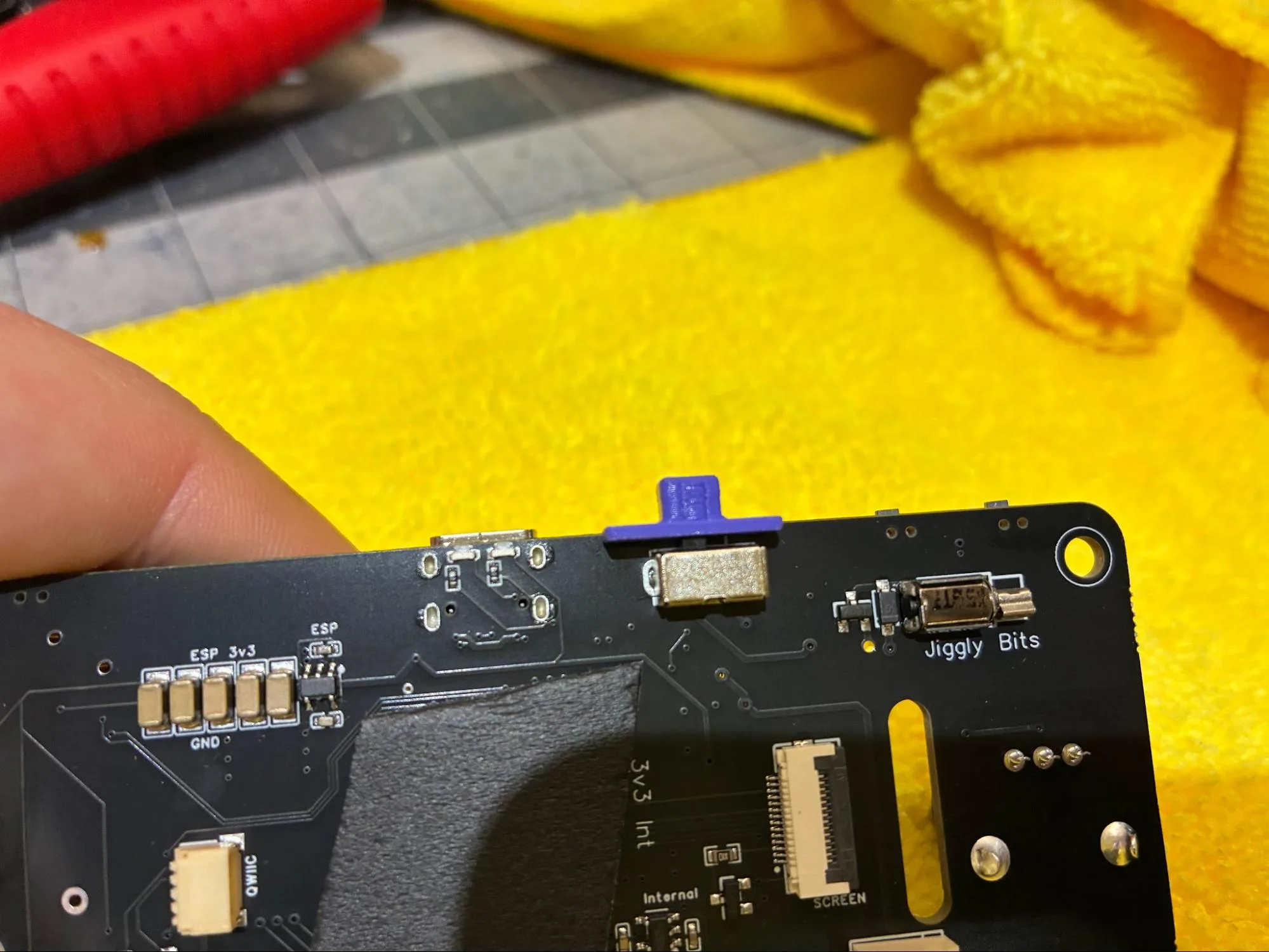 Printed power switch cover installed over the PCBA on off switch