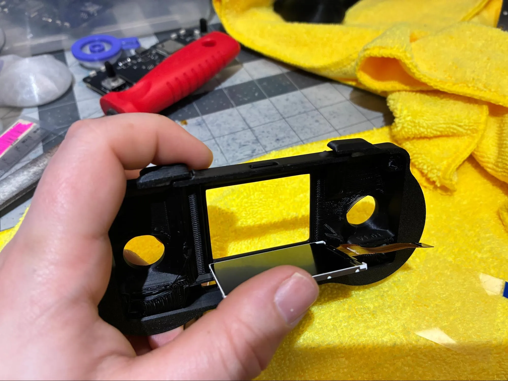 Display being inserted into the lower lip of the RADR front housing